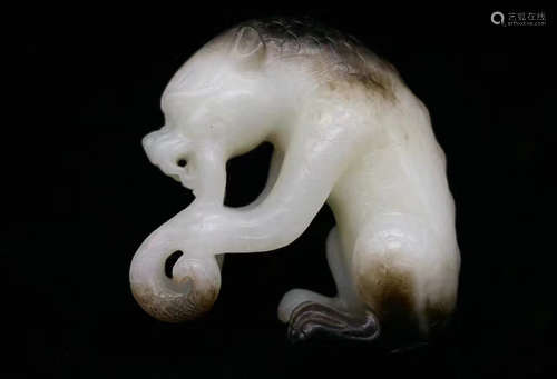 A YUAN DYNASTY HETIAN JADE AUSPICIOUS ANIMAL ORNAMENT