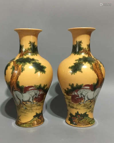 A PAIR OF QING DYNASTY FAMILLE-ROSE VASES