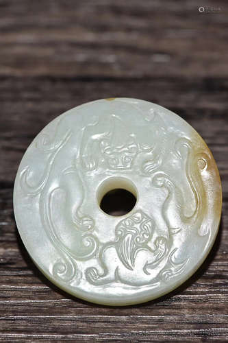 A QING DYNASTY HETIAN JADE SEED MATERIAL DRAGON DESGIN PENDANT