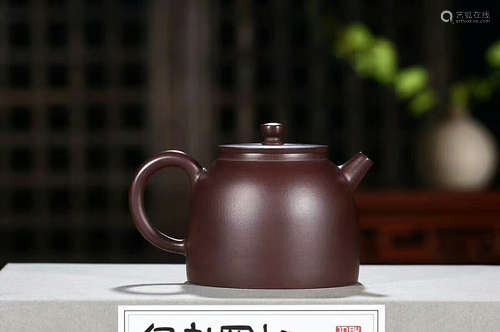 A PURPLE CLAY TEAPOT