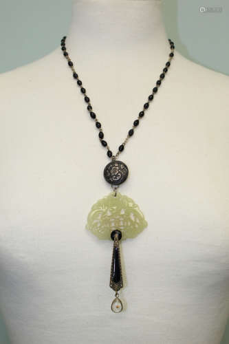 Necklace with yellow jade pendant.