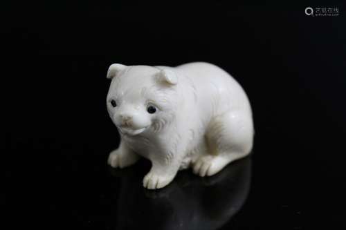 Japanese carved netsuke of a dog.