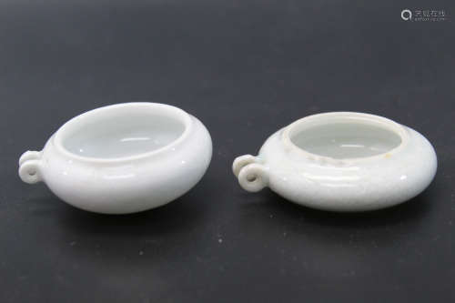 Two Chinese incised porcelain bird feeders, Qing