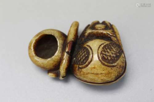 Japanese carved bone netsuke of a mokugyo.