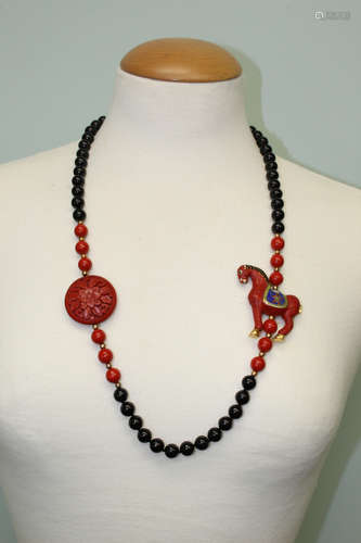 Cinnabar and cloisonne necklace.