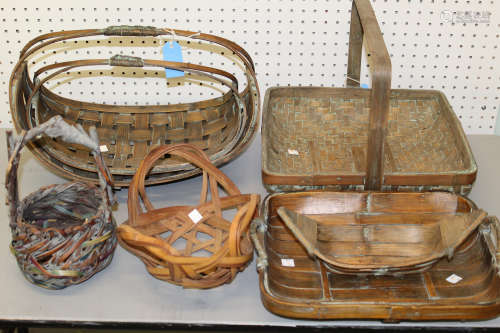 Group of seven Japanese bamboo flower baskets.