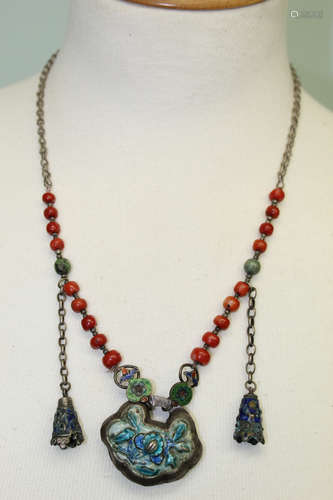 Chinese red coral necklace with silver pendant.