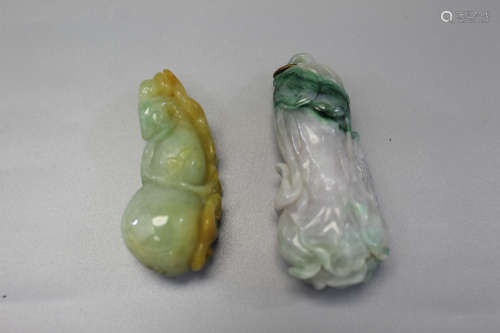 Two Chinese carved jadeite pendants.