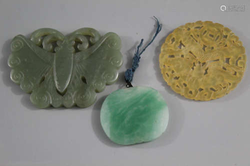 Three Chinese carved jade pendants.
