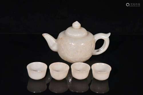A Carved Hetian Jade Teapot With Four Cups