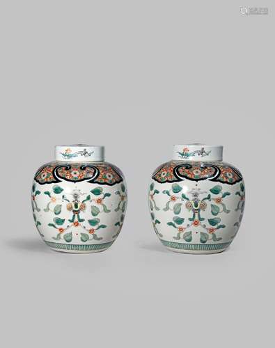 A PAIR OF CHINESE FAMILLE VERTE JARS AND COVERS