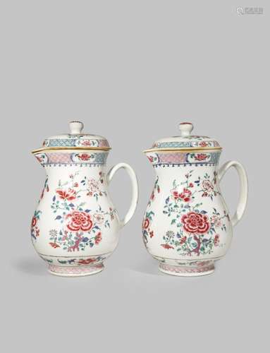 A PAIR OF LARGE CHINESE FAMILLE ROSE JUGS AND COVERS