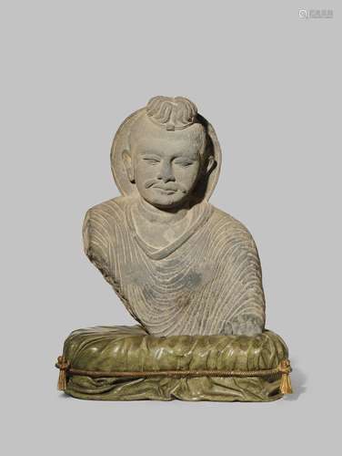 A GANDHARAN GREY SCHIST BUST OF BUDDHA SAKYAMUNI