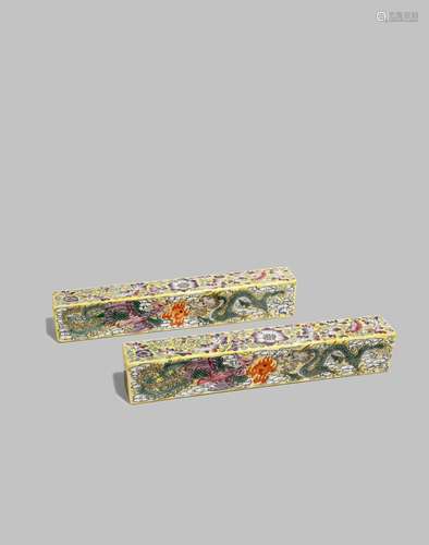 A PAIR OF CHINESE FAMILLE ROSE YELLOW-GROUND SCROLL WEIGHTS