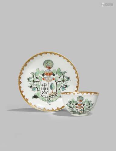 A CHINESE ARMORIAL TEA BOWL AND SAUCER