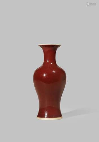 A SMALL CHINESE COPPER-RED BALUSTER VASE