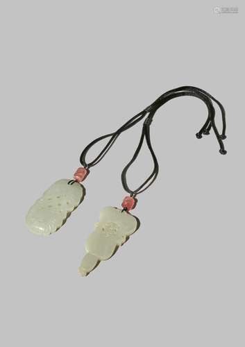 TWO CHINESE PALE CELADON JADE PENDANTS