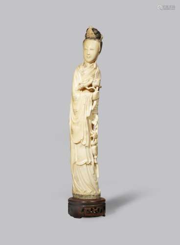 A CHINESE IVORY FIGURE OF MAGU