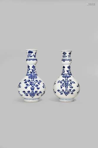 A PAIR OF CHINESE BLUE AND WHITE BOTTLE VASES