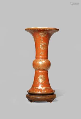 A CHINESE CORAL-GROUND GU-SHAPED VASE