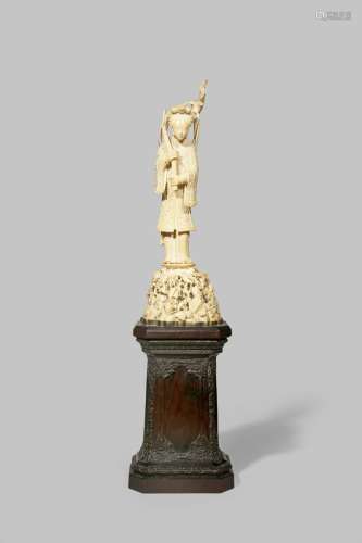 A CHINESE IVORY FIGURE OF A MAIDEN