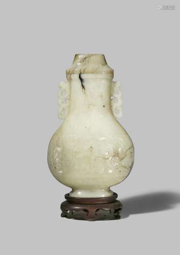 A CHINESE PALE CELADON JADE ARCHAISTIC VASE AND COVER