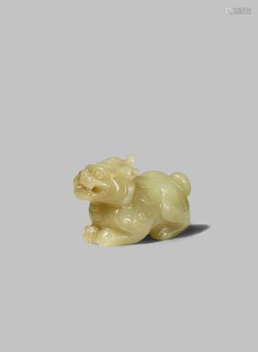 A CHINESE YELLOW JADE CARVING OF A QILIN