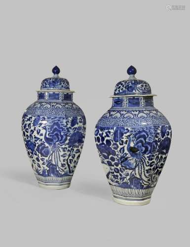 A NEAR PAIR OF LARGE JAPANESE ARITA BLUE AND WHITE VASES AND COVERS