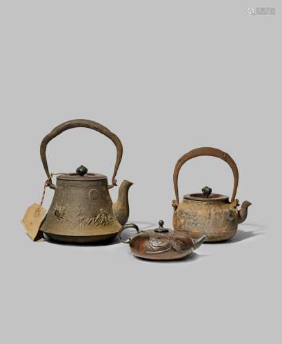 TWO JAPANESE CAST-IRON KETTLES AND COVERS