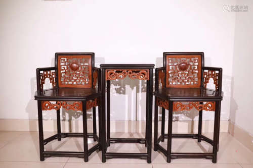 THREE ZITAN WOOD CARVED TABLE AND CHAIRS