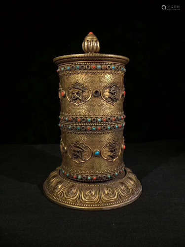 A GILT BRONZE CARVED TIBET PRAYER WHEEL