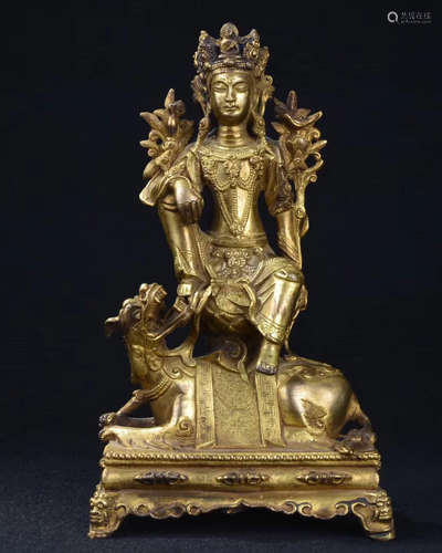 A BRONE GLITED GUANYIN FIGURE