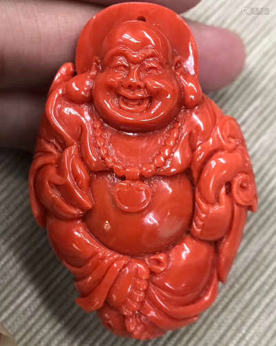 A MOMO CORAL CARVED BUDDHA FIGURE