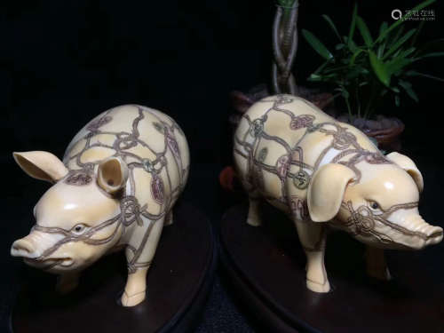TWO PIG FIGURES