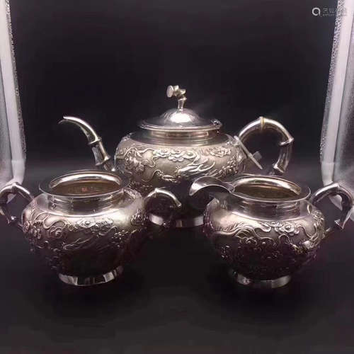 THREE SILVER CARVED POTS