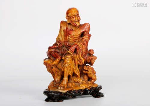 A chinese shoushan stone statue with rosewood base