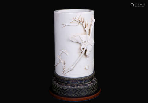 A chinese white glaze carved brush pot