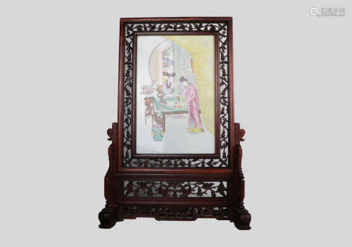A chinese porcelain screen with hardwood frame