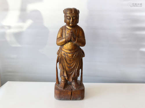 A chinese carved wood statue
