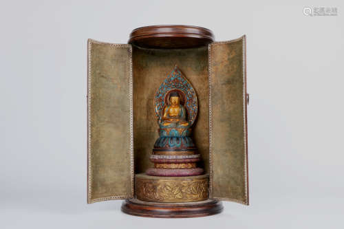 A chinese gold gilt bronze buddha with rosewood base