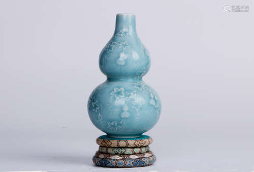 A chinese carved gourd shape porcelain bottle