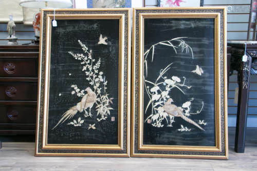 A pair of japanese carved lacquer set bone screens