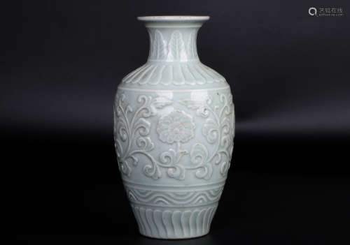 A chinese porcelain carved vase
