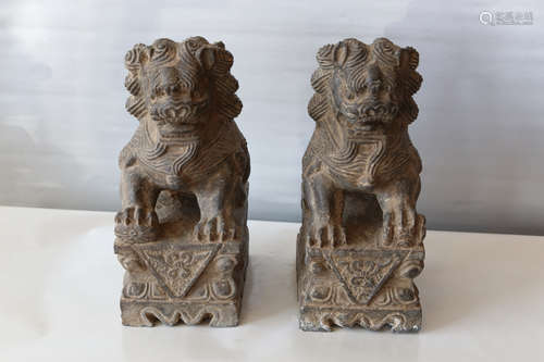 A pair of chinese carved black stone lion statue