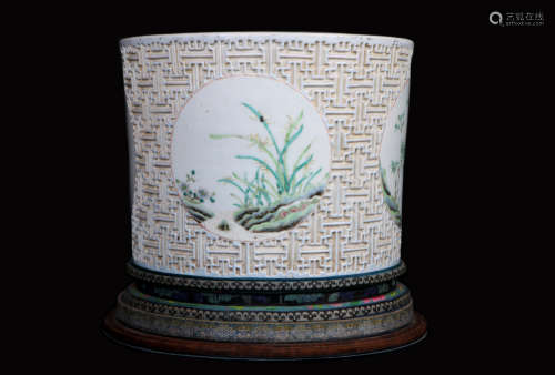 A chinese porcelain carved brush pot