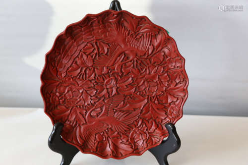 A chinese carved lacquer plate