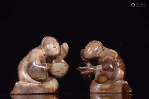 A PAIR OF HAN DYNASTY LIGHT GREENISH WHITE JADE FIGURE ORNAMENT