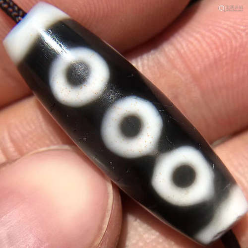 A TIBETAN FIVE-EYE DZI BEADS