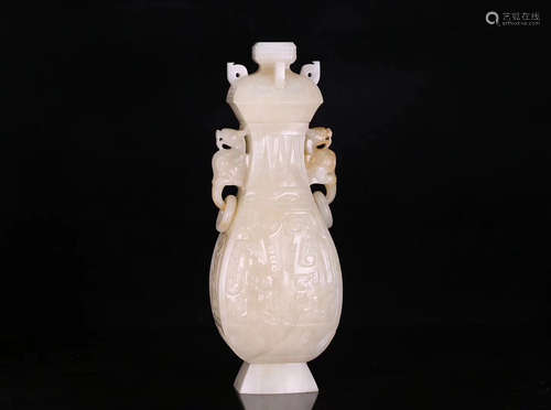 A HETIAN JADE DOUBLE DRAGON SHAPED EAR VASE, QING DYNASTY