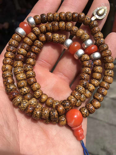 AN OLD TIBETAN NANJIANG CARNELIAN AND CORAL BODHI PRAYER BEADS